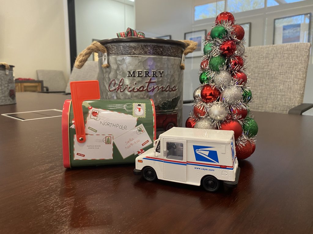 Christmas tree, Christmas mailbox with a mail truck in front of a merry christmas can