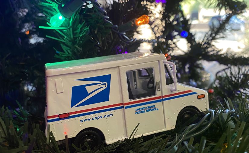 mail truck for the usps postal service in a christmas tree for mailing on postal holidays