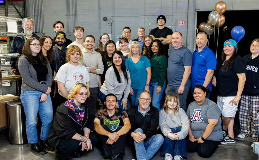 LetterStream's printing and mailing team gathered around to celebrate Q3.